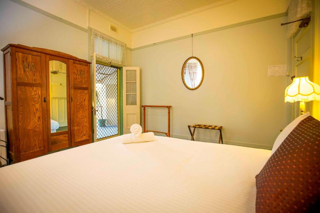 Heritage queen room with wardrobe